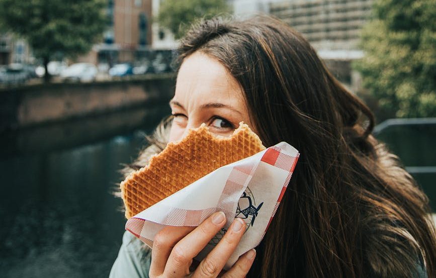 woman holding baked pastry