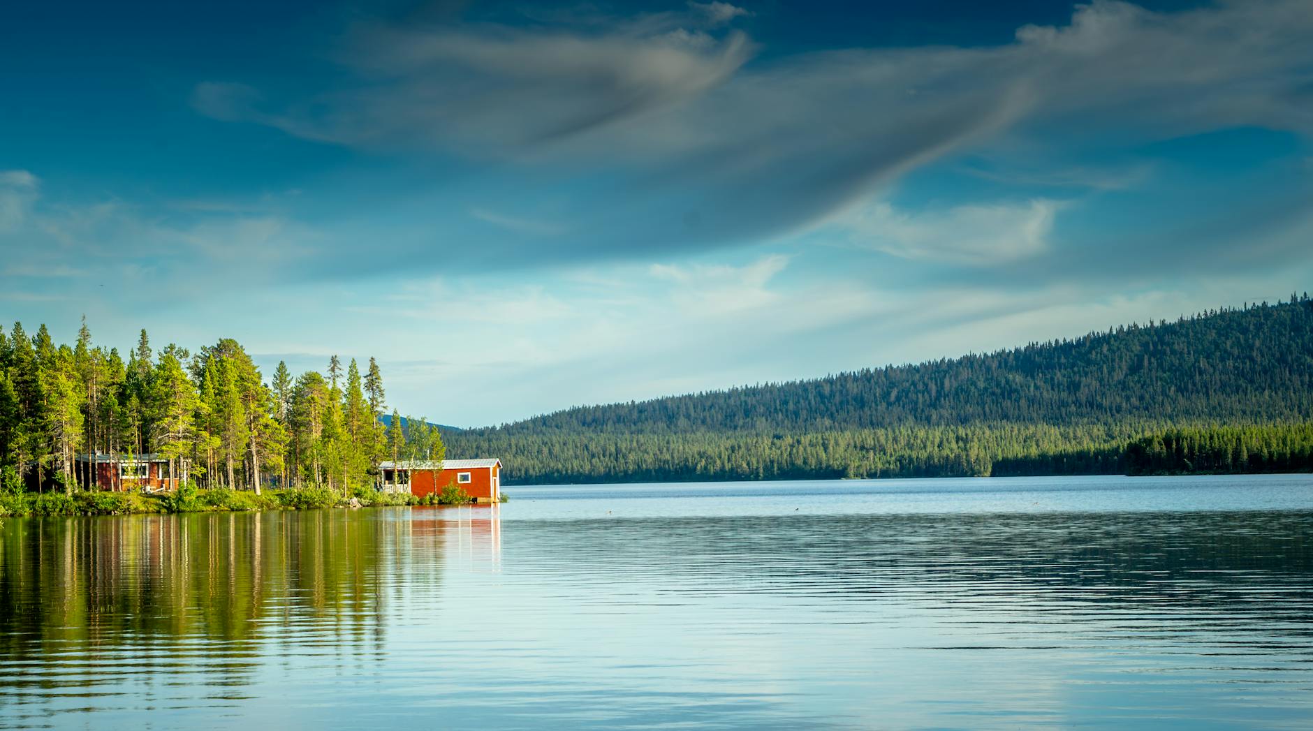 red house by lake